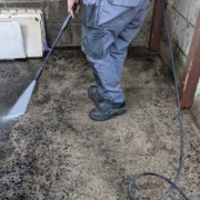 Powerwashing at Edinburgh communal bins after removing rubbish and rats.
